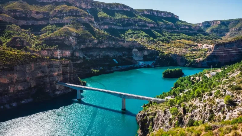 Turquoise reservoir and mountain roads at Cortes de Pallás, Valencia